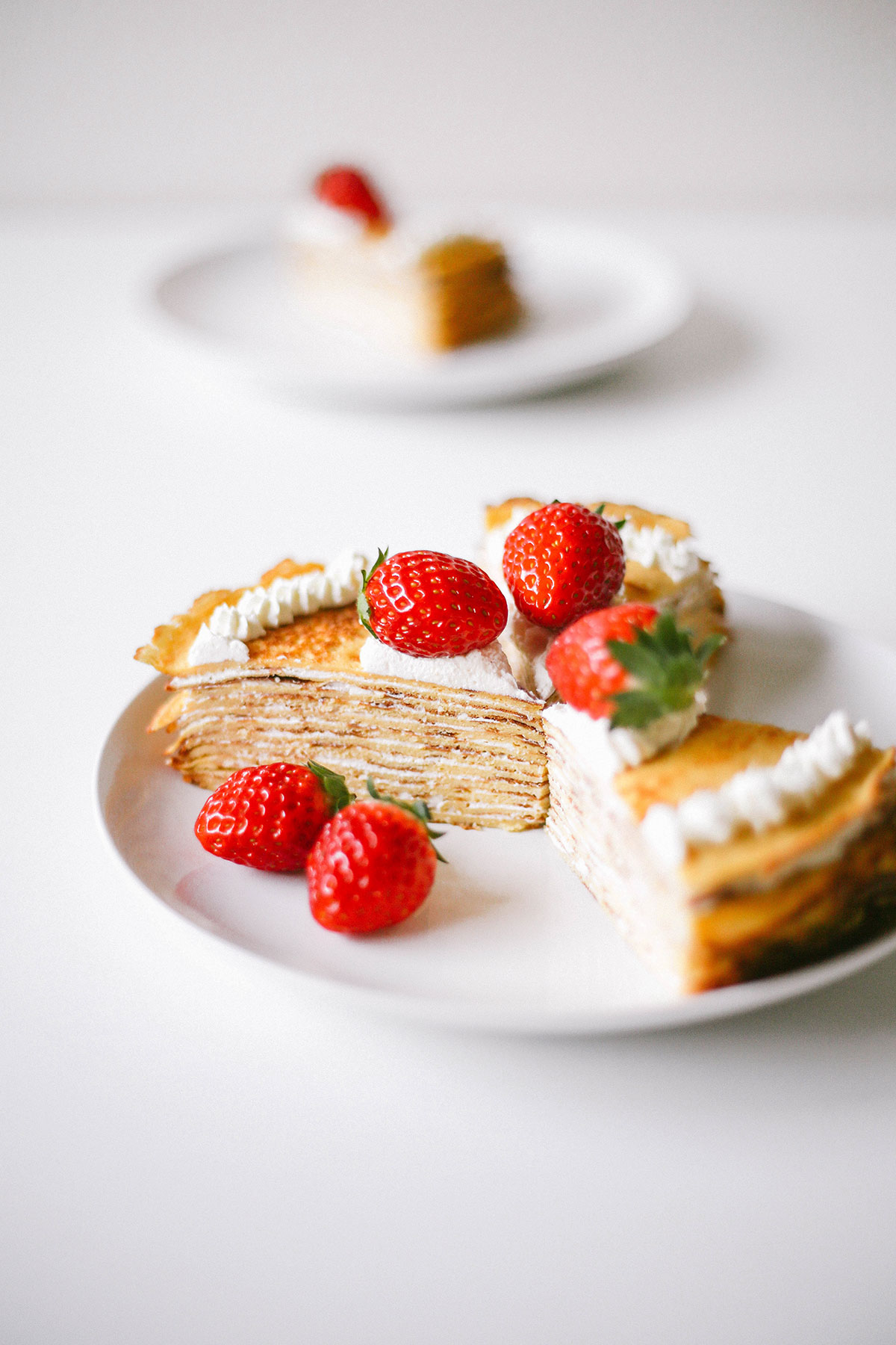 Keto crepe cake for low carb. Easy mille crepe recipe served with strawberries.